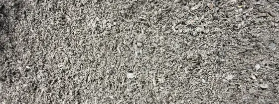 Close-up of loose dark gray-brown Garden Mix with fine compost and small wood bits